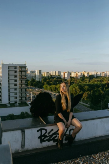 a woman sitting on top of a roof holding an umbrella, an album cover, by Julia Pishtar, pexels contest winner, slavic city. big mushrooms, portrait of kim petras, panorama view, black wings