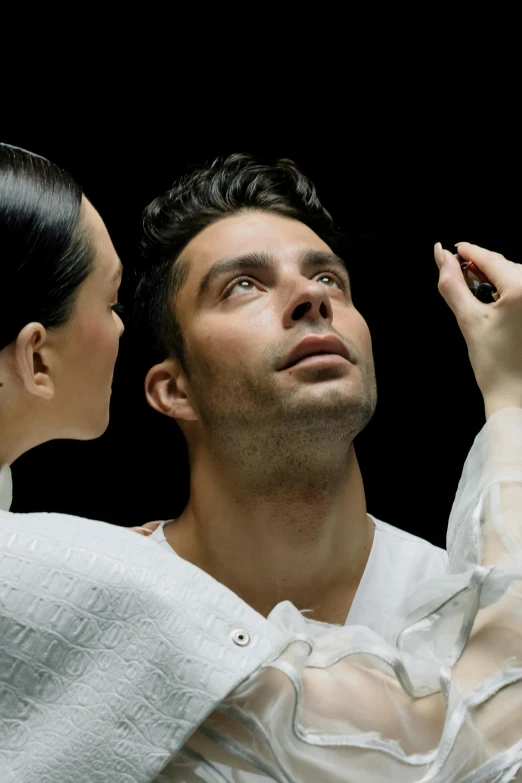 a man in a white shirt and a woman