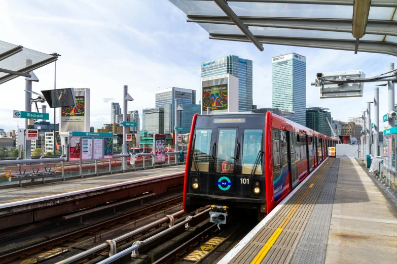 a red and black train pulling into a train station, by Joseph Severn, shutterstock, canary wharf, orange line, surrounding the city, 🚿🗝📝