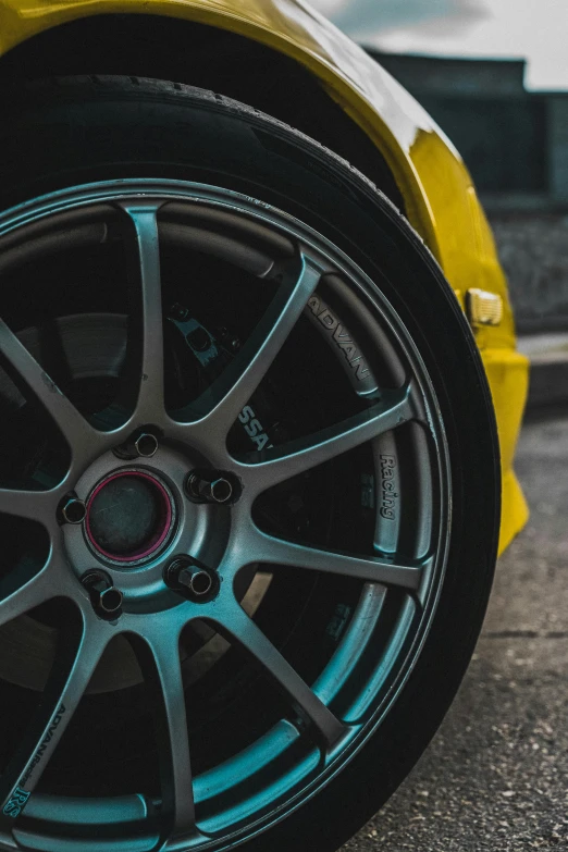 a yellow sports car parked on the side of the road, pexels contest winner, detailed alloy wheels, medium closeup, intricate image, inspect in inventory image