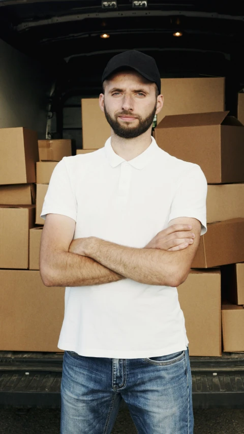 a man standing in front of a truck full of boxes, pexels contest winner, renaissance, white wearing, portrait image, ethan klein, promotional image