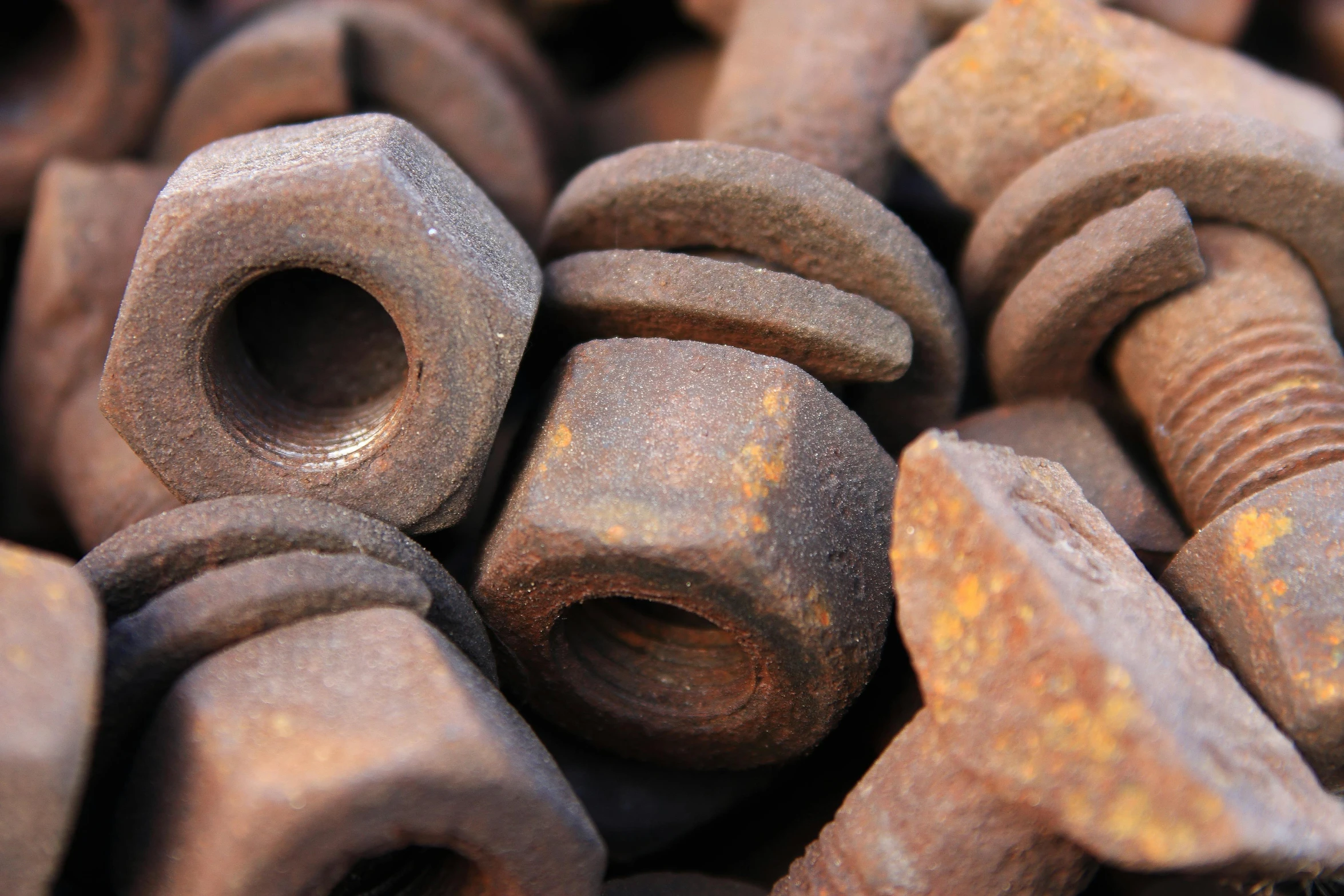 a pile of nuts and bolts sitting on top of each other, unsplash, renaissance, bent rusted iron, detailed product image, chocolate. rugged, medium close up