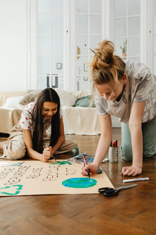 two girls sitting on the floor drawing on a piece of paper, pexels contest winner, arbeitsrat für kunst, tabletop game board, math inspired, paint on canvas, creative coding