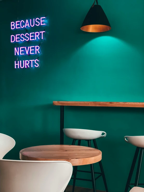 a neon sign that says because dessert never hurts, inspired by Bruce Nauman, trending on unsplash, stools, profile image, teal, set on singaporean aesthetic