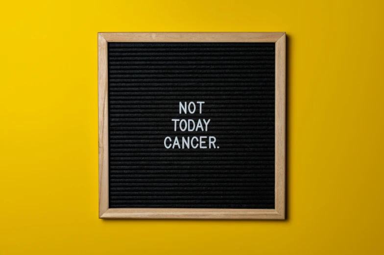 a sign that says not today cancer on a yellow background, a picture, pexels, chalkboard, no curves, black, instagram picture