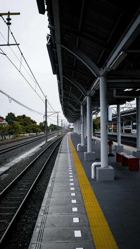 a train station with a train on the tracks, unsplash, hyperrealism, kumamoto, ultra realistic 8k octa photo