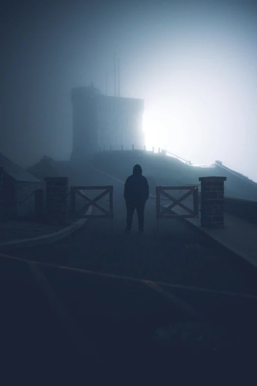 a person standing in front of a gate on a foggy day, inspired by jessica rossier, pexels contest winner, silent hill game, (night), standing on rooftop, 'silent hill '