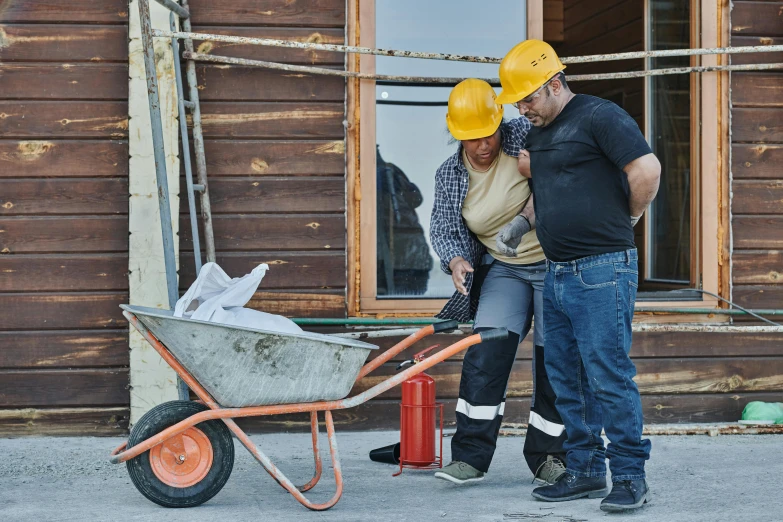a man and a woman standing next to a wheelbarrow, pexels contest winner, construction site, injured, background image, thumbnail