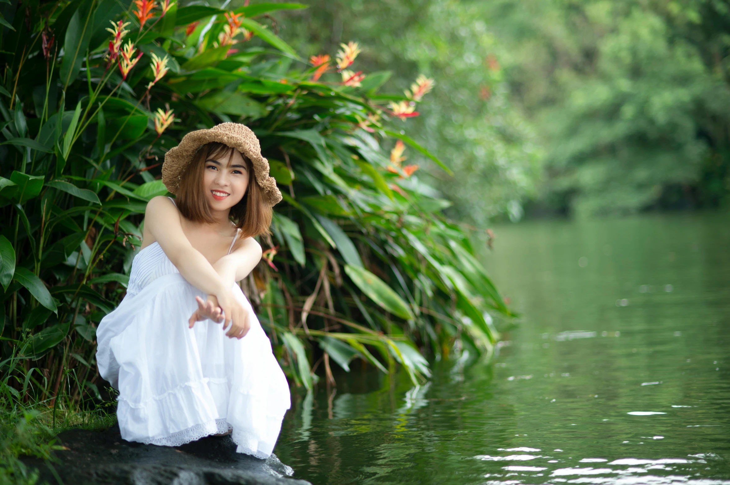 a woman sitting on a rock in the water, an album cover, inspired by Fernando Amorsolo, unsplash, sumatraism, wearing a white sundress, pond, avatar image, happy girl