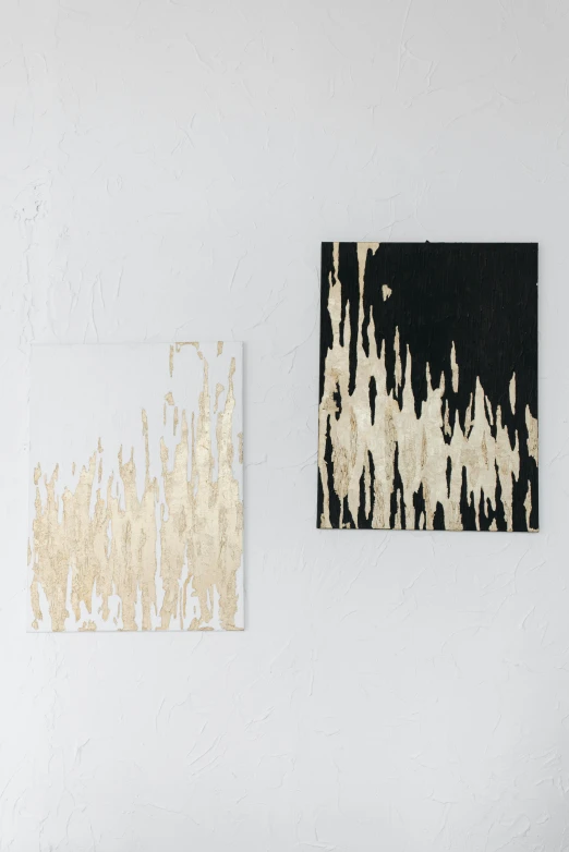 a living room with a couch and paintings on the wall, a minimalist painting, inspired by Lucio Fontana, trending on unsplash, abstract art, torn paper smouldering smoke, diptych, black and gold wires, synthetic polymer paint on linen