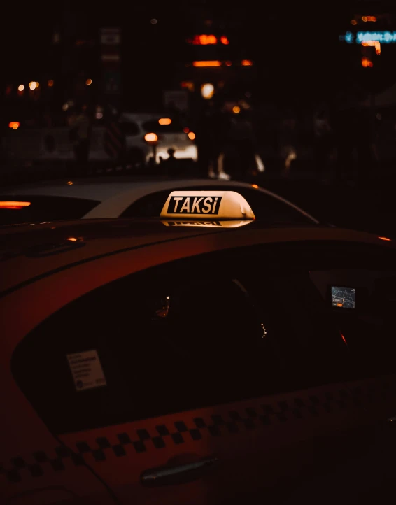 the yellow taxi sign is displayed on the top of the cab