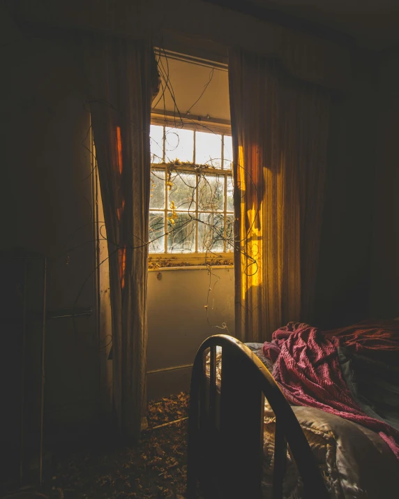 a dark bedroom with lights shining out of the window