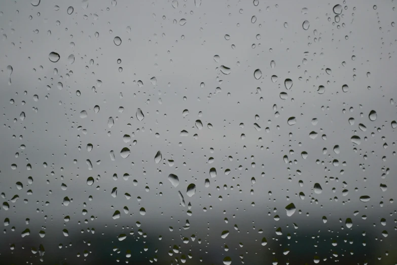 a close up of water droplets on a window, by Ryan Pancoast, pexels, overcast gray skies, rainy day. game render, ilustration, background image