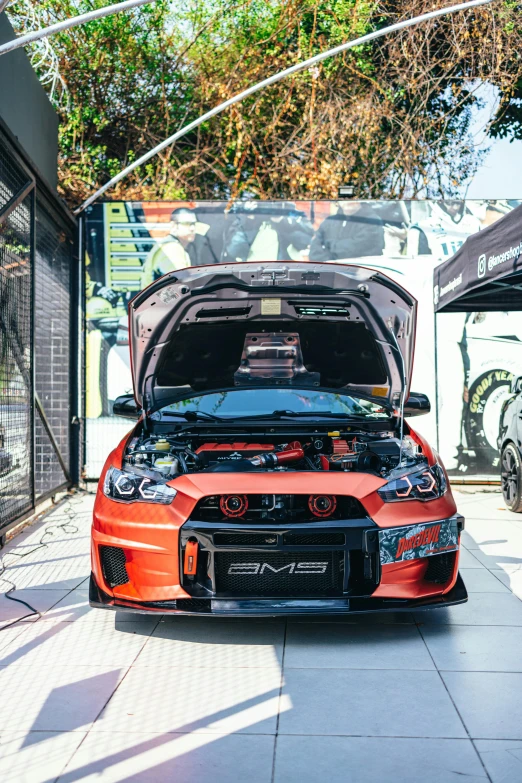 a car that is parked in a garage, on a street race track, indonesia, full dress of lava showcase, shibu inu