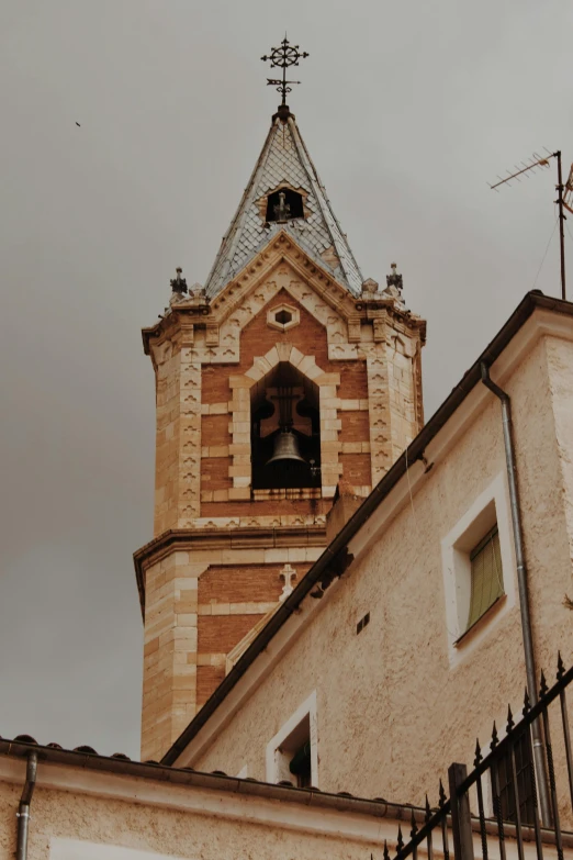 a tall tower with a clock on top of it, inspired by Taddeo Gaddi, unsplash, romanesque, low quality photo, bells, 2 5 6 x 2 5 6 pixels, french village exterior