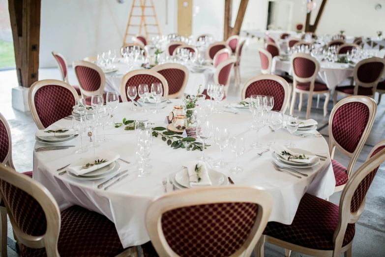 a dining room filled with lots of tables and chairs, a portrait, by Romain brook, unsplash, renaissance, wedding, white and red color scheme, round, teaser