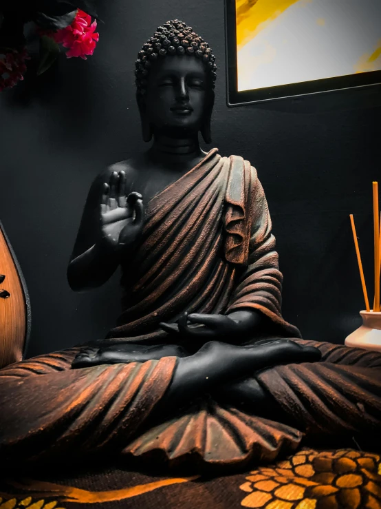 a statue of a person sitting in a meditation position, a statue, pexels contest winner, black and brown colors, wearing dark silk robe, two buddies sitting in a room, anjali mudra