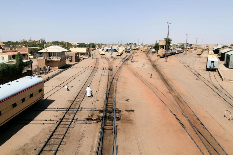 a couple of trains that are on some tracks, an album cover, unsplash, dau-al-set, timbuktu, very wide view, terminal, getty images