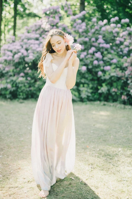 a woman standing on top of a lush green field, inspired by Oleg Oprisco, unsplash, renaissance, prima ballerina in rose garden, light blush, beautiful young asian woman, 15081959 21121991 01012000 4k