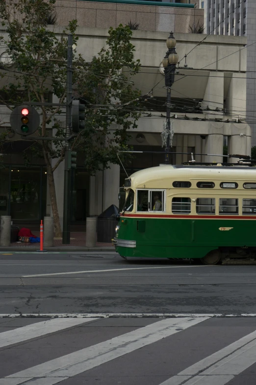 the old bus has been painted green and white