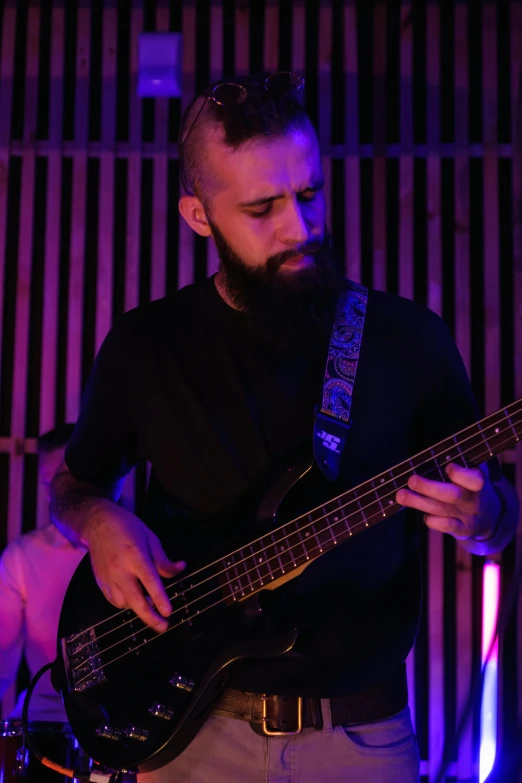 a man with a beard playing a bass guitar, profile image, edin durmisevic, ash thorp khyzyl saleem, rectangle