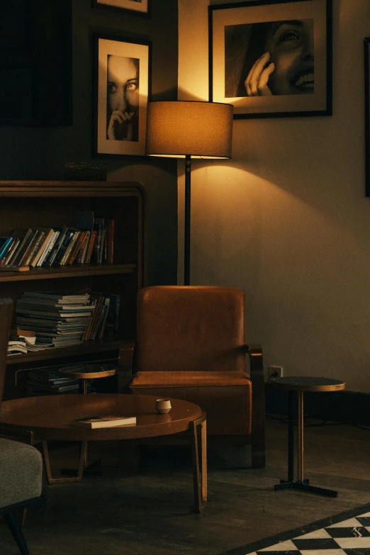 a room filled with wooden furniture and pictures on the wall