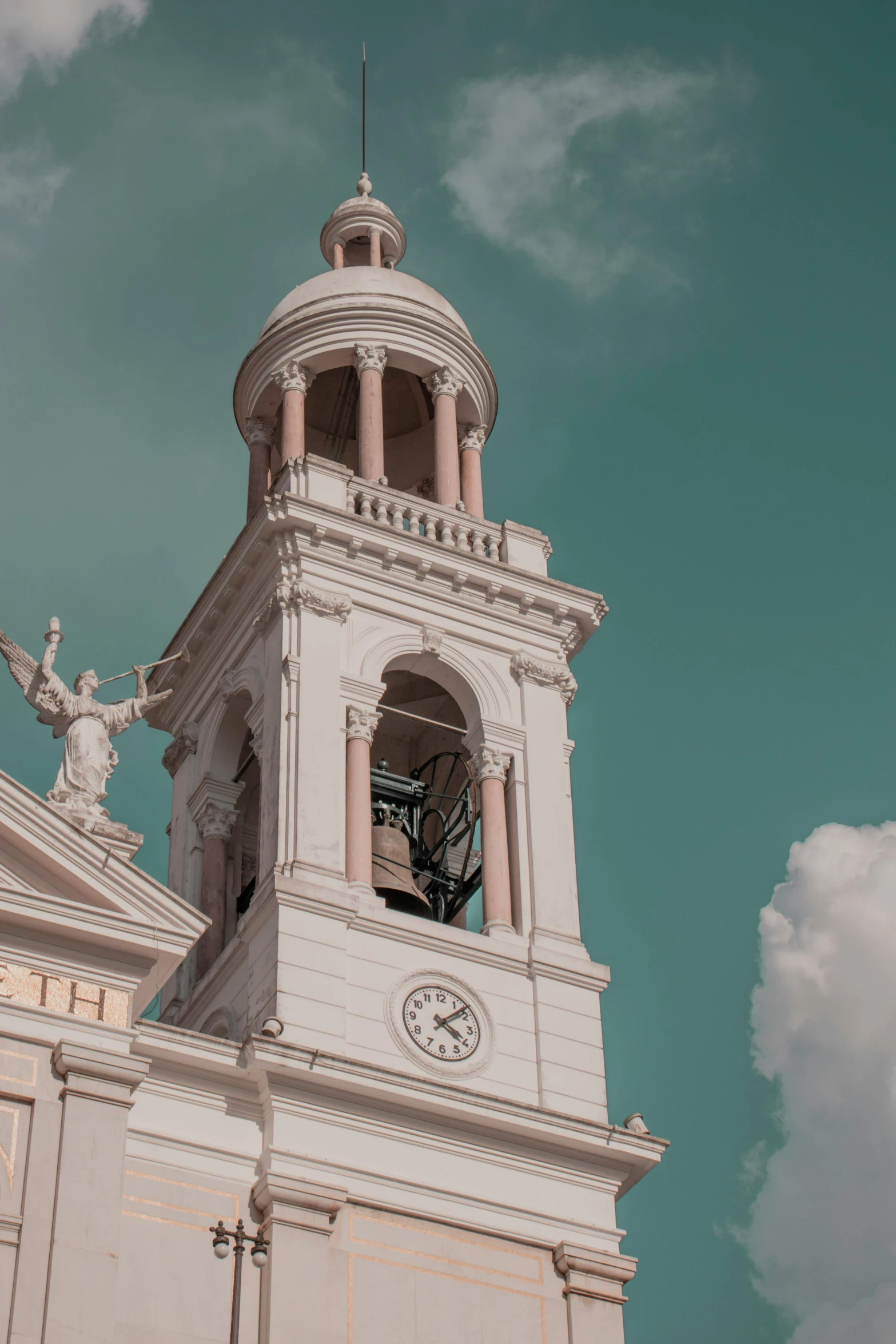a large white building with a clock tower, a colorized photo, inspired by Christopher Wren, trending on unsplash, neoclassicism, puerto rico, profile image, domes, up there
