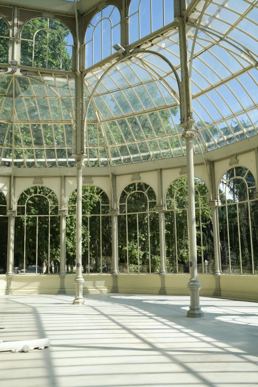 inside of a very large building that has lots of windows