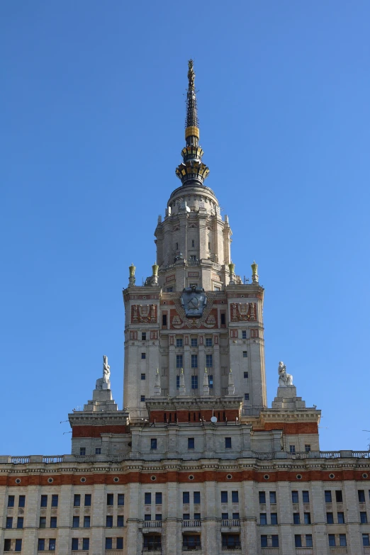 a tall building with a clock on top of it, inspired by Vasily Surikov, seville, huge towering magical university, up there, hestiasula head