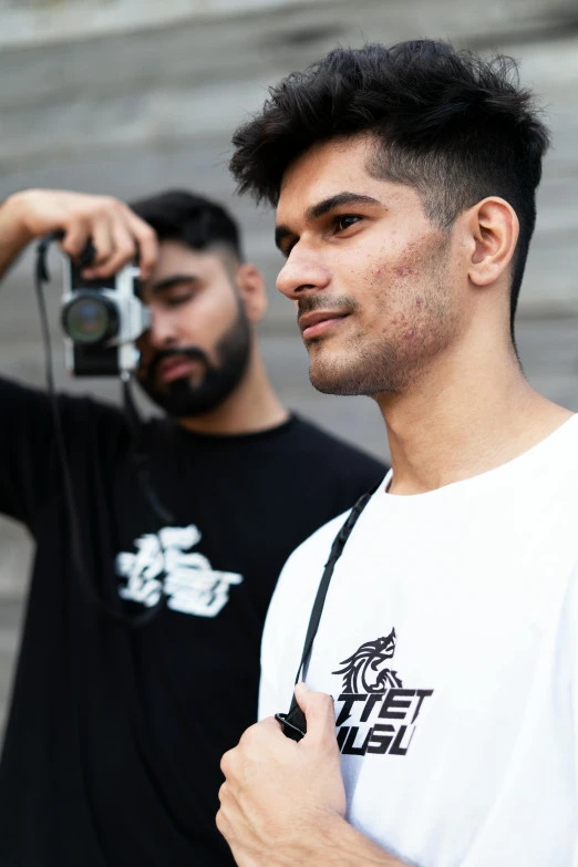 a man taking a picture of another man with a camera, pexels contest winner, visual art, in tshirt, mc escher and ronny khalil, profile shot, cybertech wear