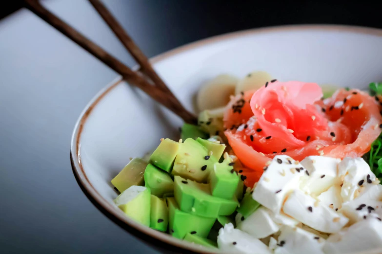 there are many fruits and vegetables in the bowl