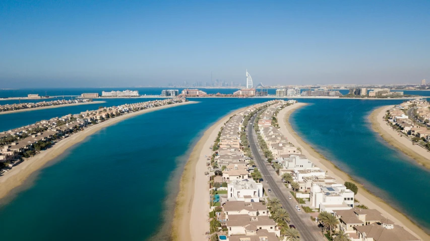 a large body of water next to a beach, by Matthias Stom, pexels contest winner, renaissance, gta : dubai, foster and partners, waterfront houses, 4k footage