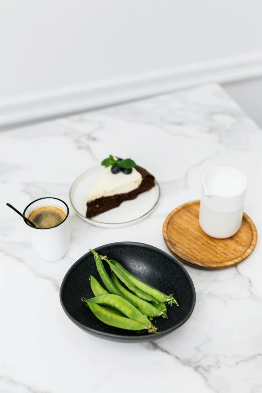 a close up of a plate of food on a table, inspired by Constantin Hansen, granite, coffee, premium, cake