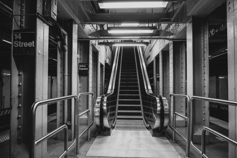 a black and white photo of an escalator, arstation, 2000s photo, interior of staten island ferry, opposite the lift-shaft