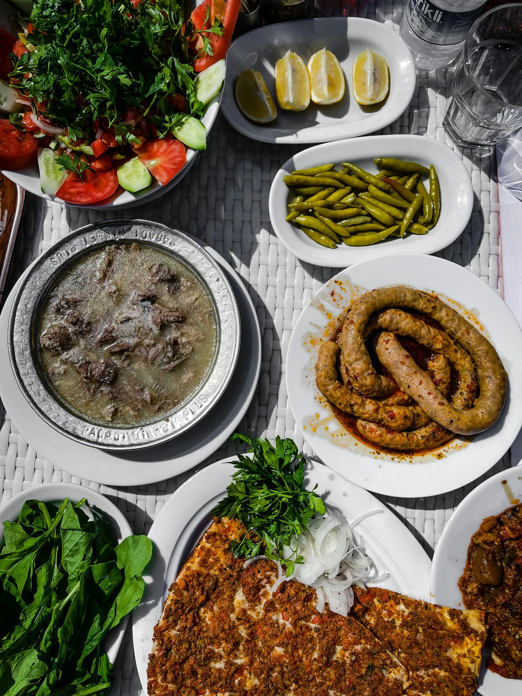 a table topped with lots of different types of food, a photo, dau-al-set, high quality picture, baris yesilbas, thumbnail, gray