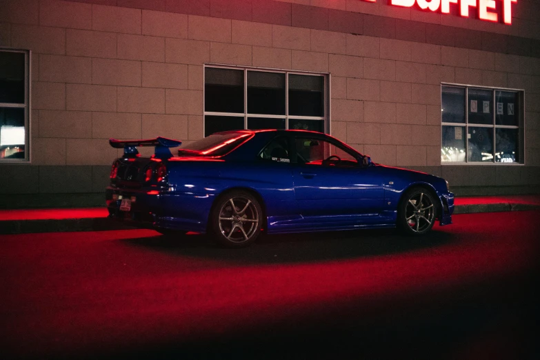 a blue car with a bike on its roof