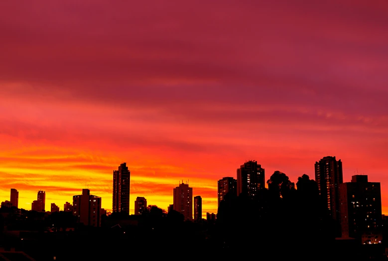 a view of a city skyline at sunset, by Doug Ohlson, happening, red skies, british columbia, colour print