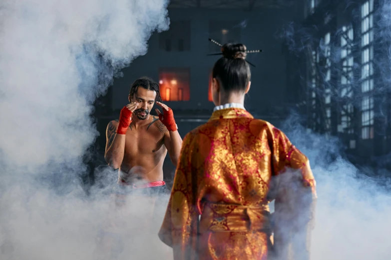 a man that is standing in the smoke wearing boxers