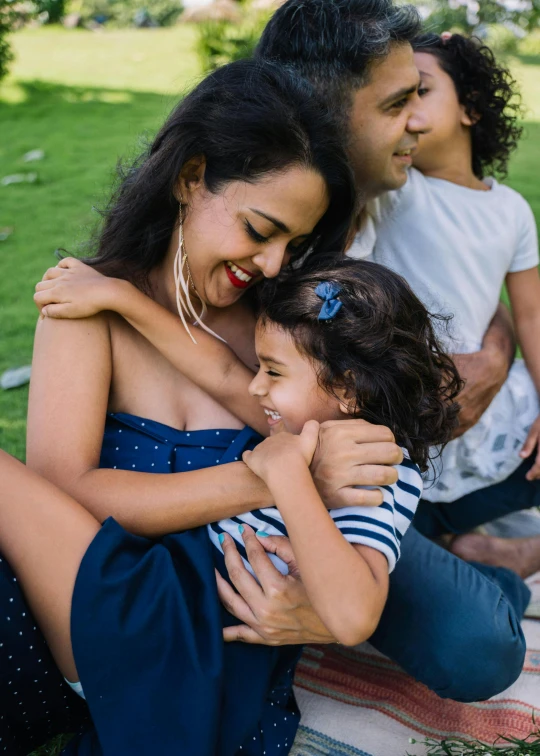 a woman and two children sitting on a blanket in a park, pexels contest winner, incoherents, hugging and cradling, husband wife and son, hispanic, avatar image