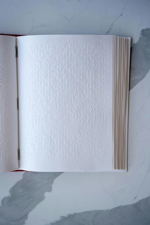 an open book sitting on top of a marble table, private press, lined in cotton, concrete poetry, embossed, subtle pattern