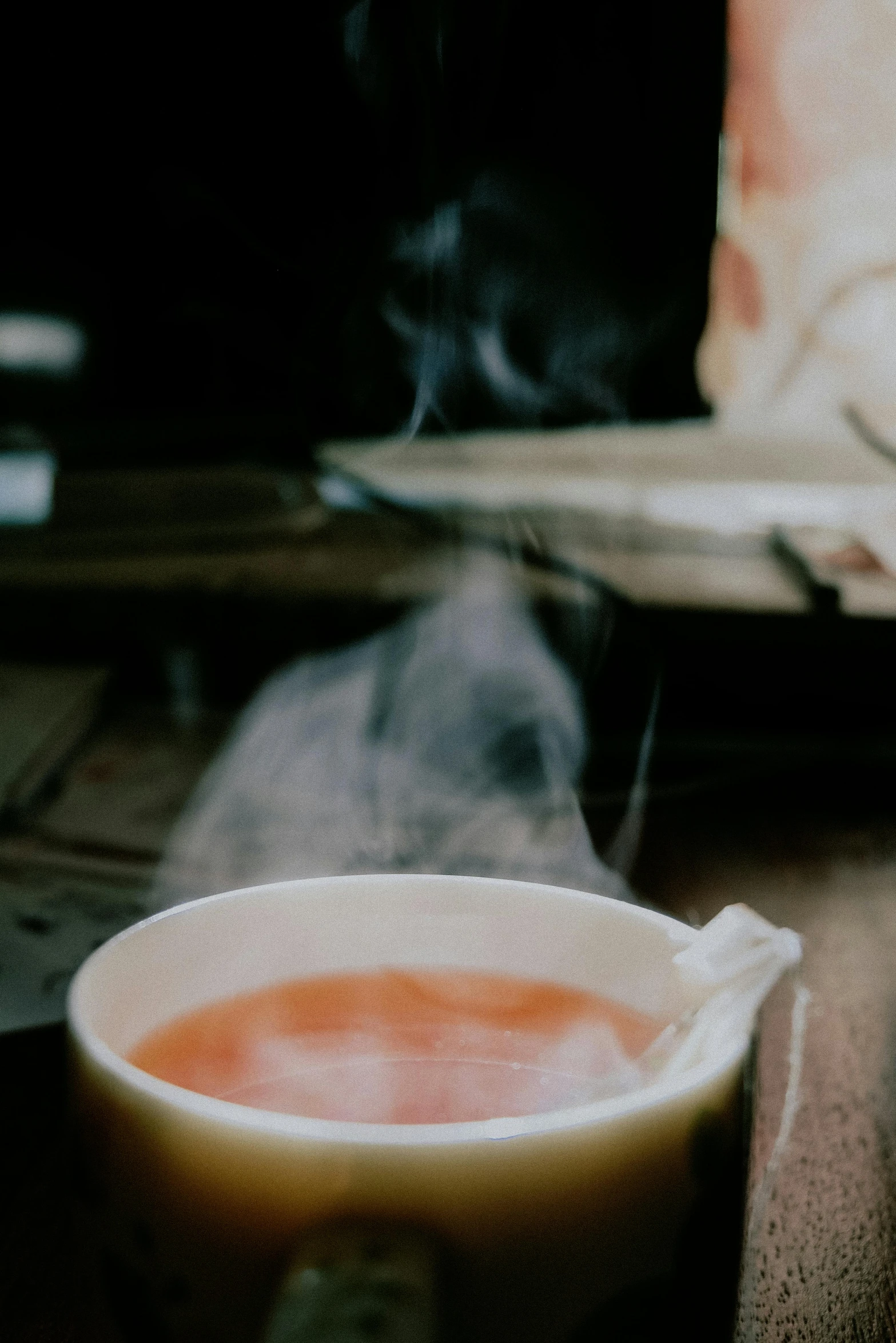 a cup of tea sitting on top of a table, by Daniel Seghers, trending on unsplash, renaissance, thick pigmented smoke, hot food, promo image, soup