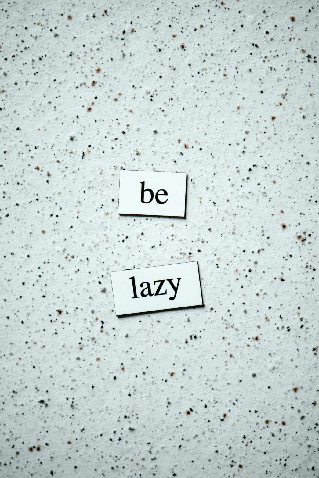two pieces of paper with the words be lazy written on them, unsplash, happening, magnetic, terrazzo, relaxed dwarf with white hair, inspirational
