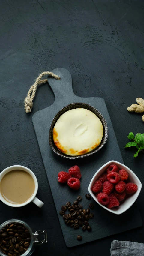 a cheesecake sitting on top of a cutting board next to a cup of coffee, a still life, unsplash, arabesque, thumbnail, rear-shot, background image, glasgow