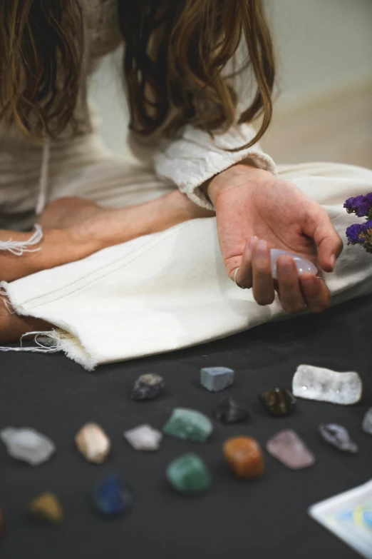 a woman looking at some pretty colorful rocks