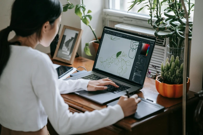 a woman sitting at a desk using a laptop computer, a computer rendering, trending on pexels, woman made of plants, geometry, draw with wacom tablet, avatar image