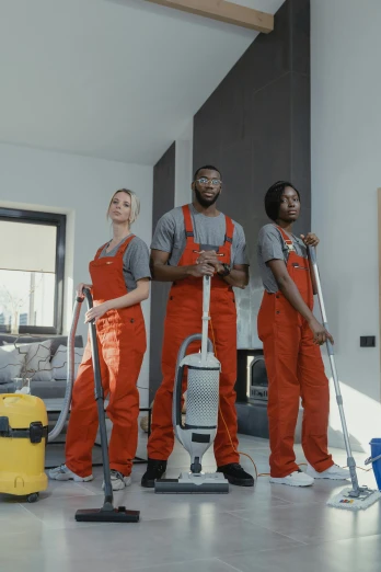 a group of people that are standing in a room, maintenance, mkbhd, grey orange, high quality upload