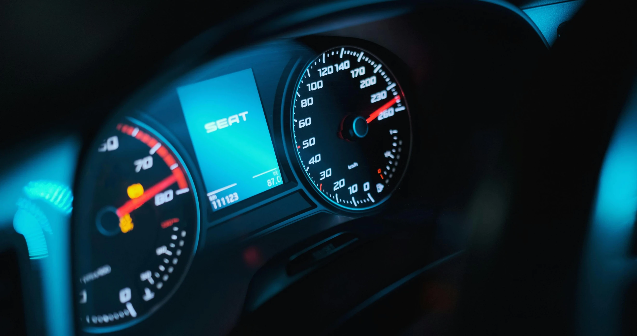 closeup on dashboard of car, with different instruments