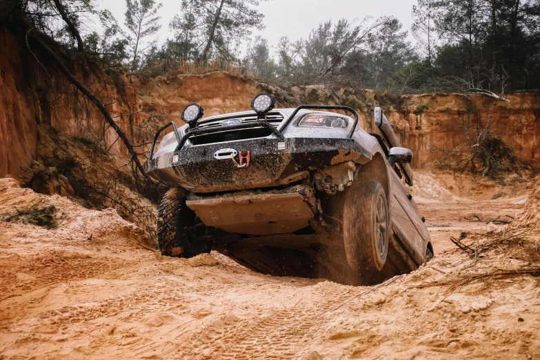 a four wheel drive off road vehicle in muddy area