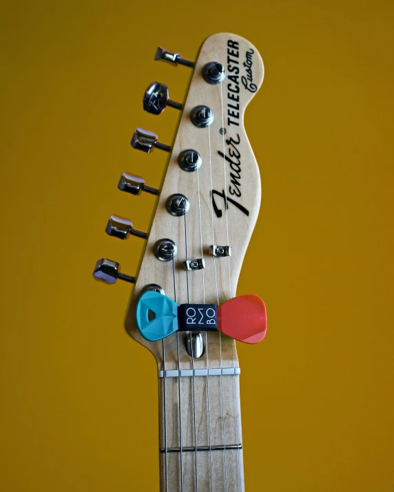 an electric guitar with an interesting, hand crafted top
