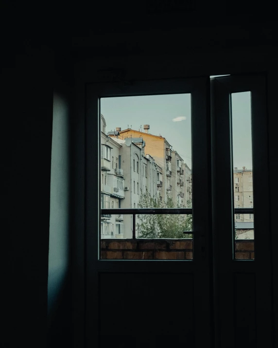 a window looking out to a street in the dark